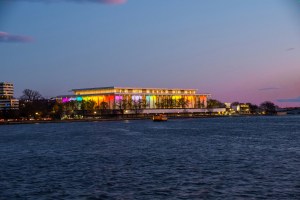 Kennedy Center lit at night with rainbow colors